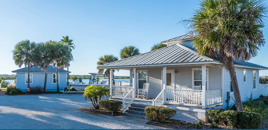 Charming fishing resort with waterfront cabins and palm trees at Devil's Elbow.